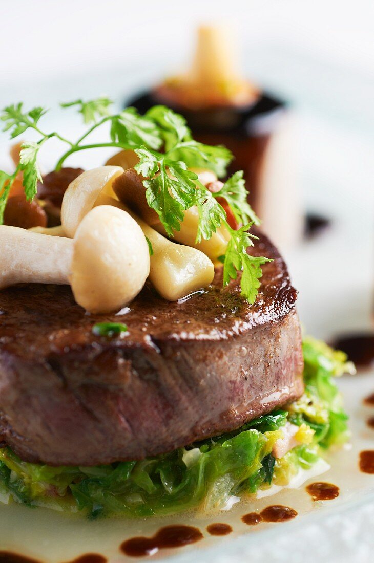 Beef medallion with mushrooms and chervil (close-up)