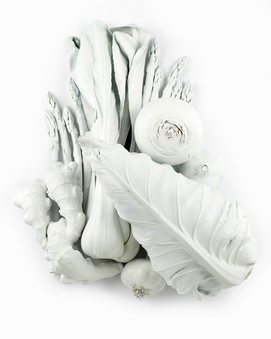 A still life in white, featuring vegetables