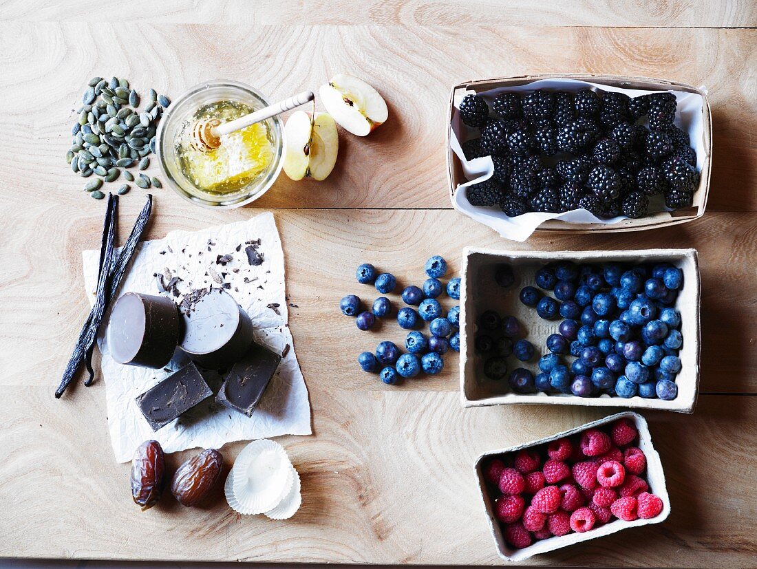 Assorted healthy baking ingredients, honey and chocolate