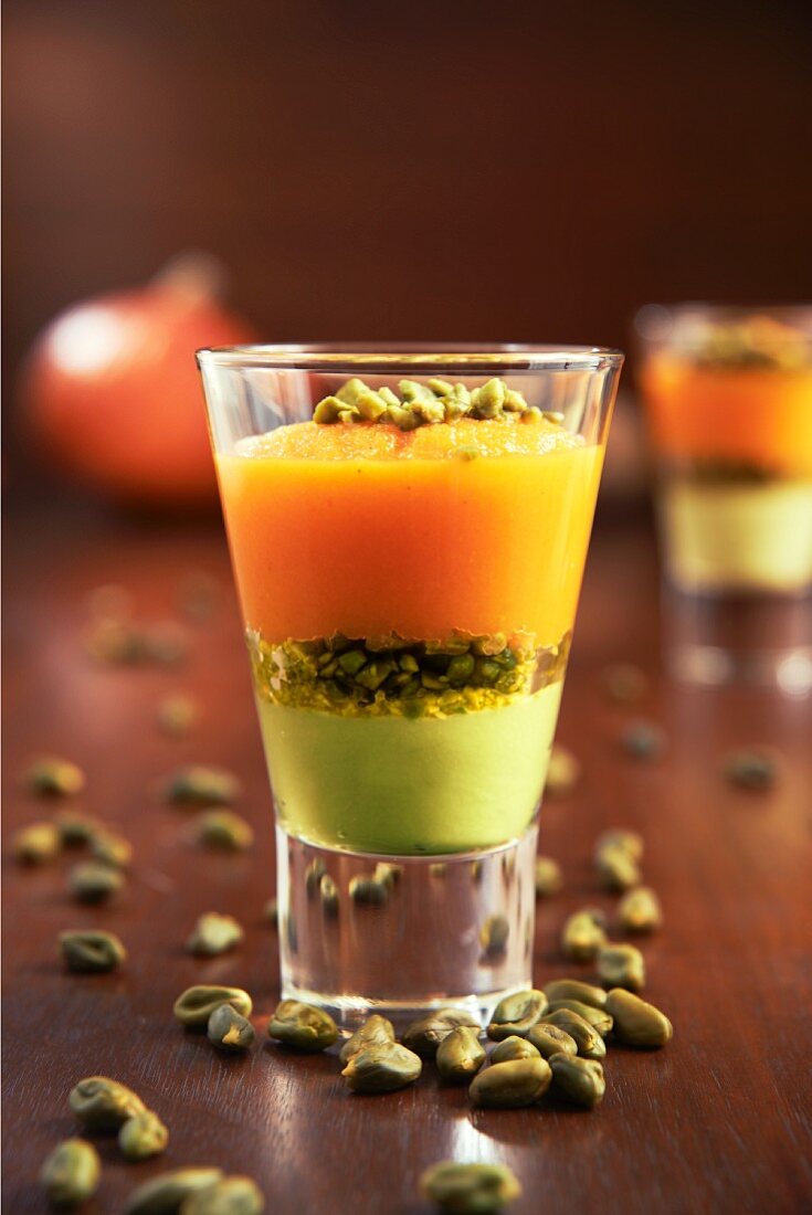 Verrines with pumpkin purée, avocado purée and pistachios