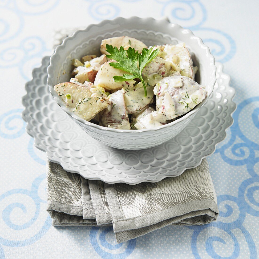 A Bowl of Cape Cod Potato Salad with Red Potatoes, Dill, Onion and Celery