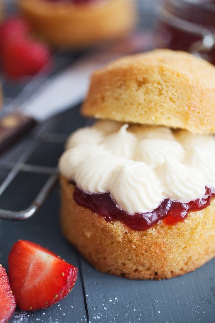A mini sponge cake with vanilla buttercream and strawberry jam
