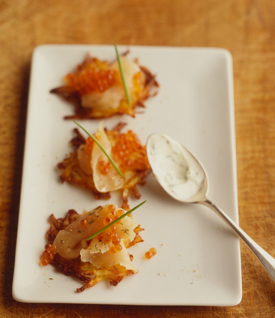 Mini potato fritters with smoked salmon and trout caviar