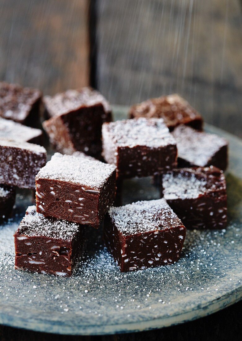 Chocolate & coconut fudge dusted with icing sugar