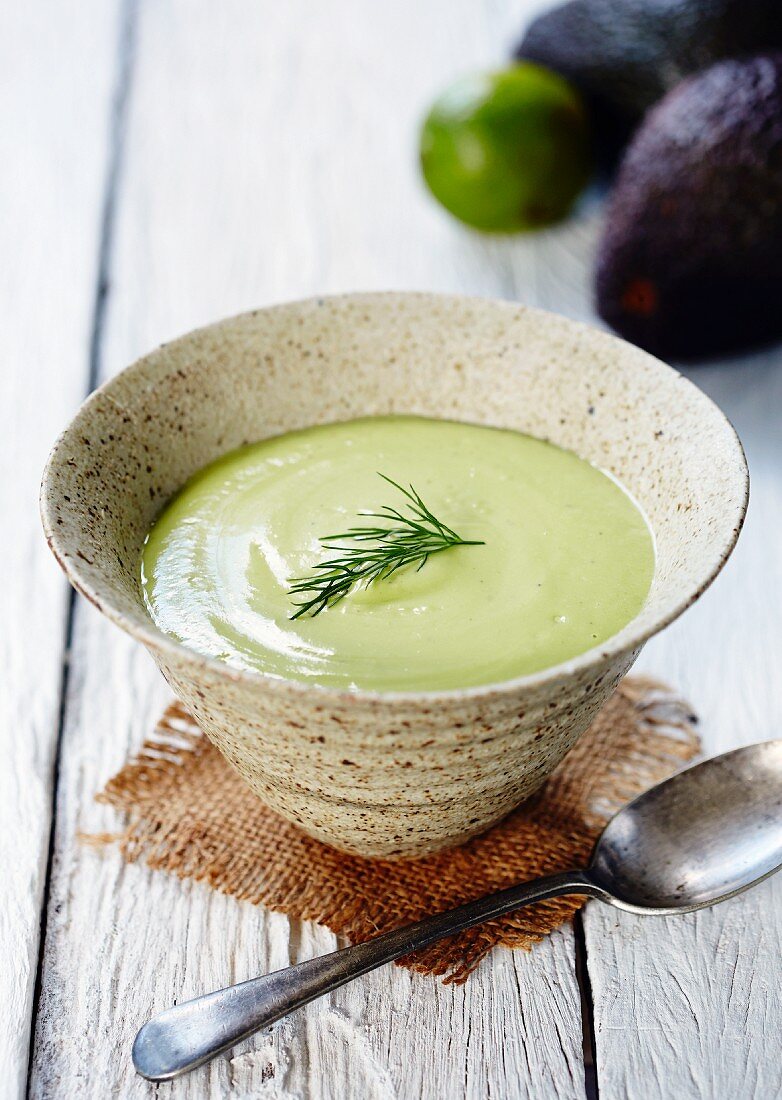 Cold avocado soup with a sprig of dill