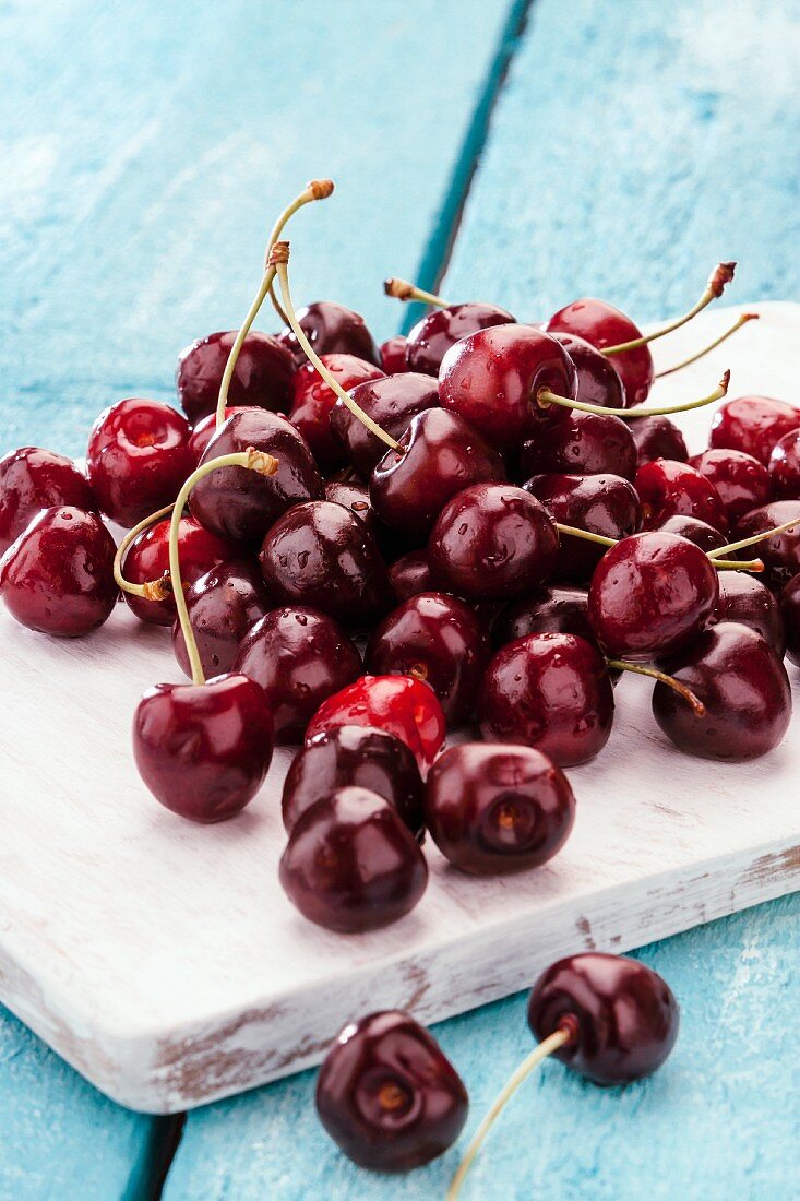 Cherries on a wooden board