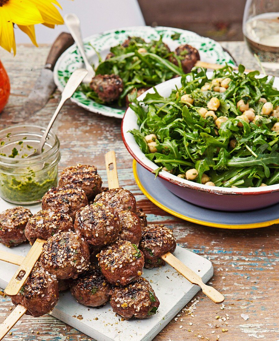 Dukkah meatballs with chickpea and rocket salad and chimichurri sauce