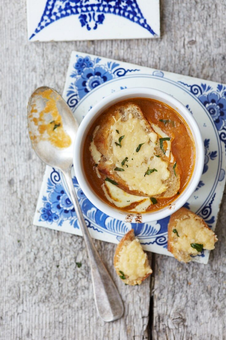 Fish soup with cheese on toast