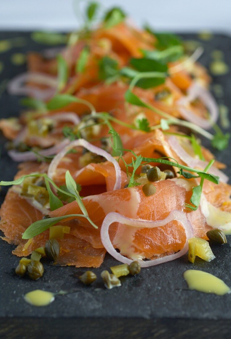 Gravad lax with a citrus marinade, onions and capers