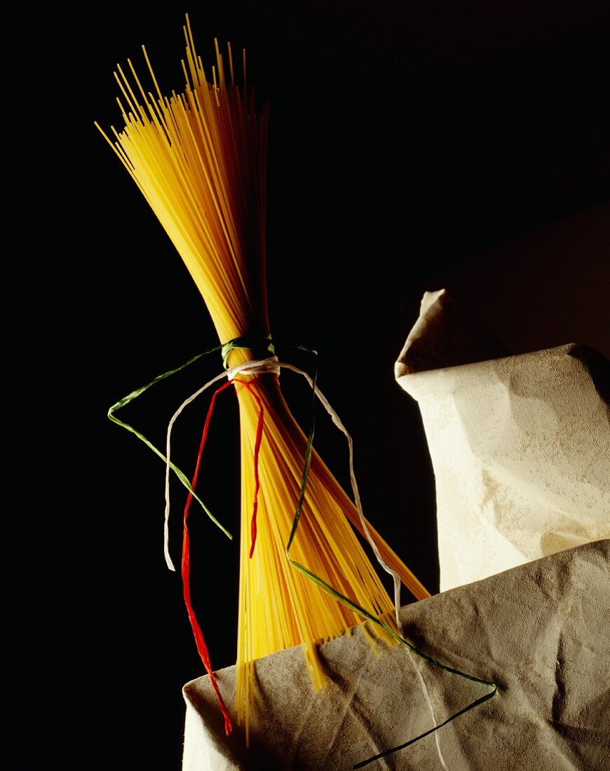 Spaghetti tied in a bunch with green, white and red ribbons