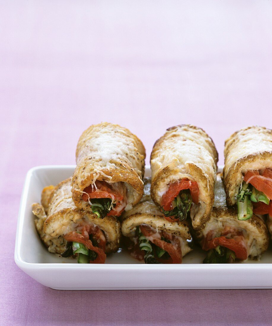Rolls of pork stuffed with vegetables and cheese