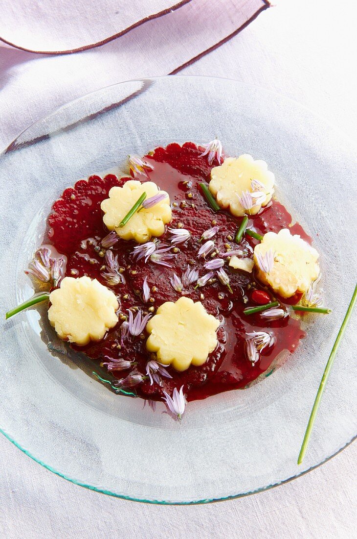 Beetroot carpaccio with edible flowers
