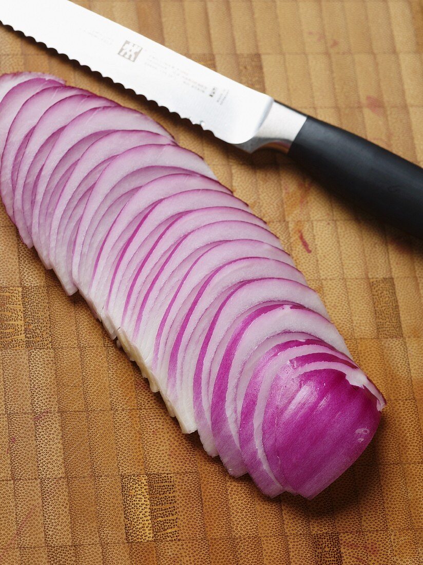 A red onion cut into slices