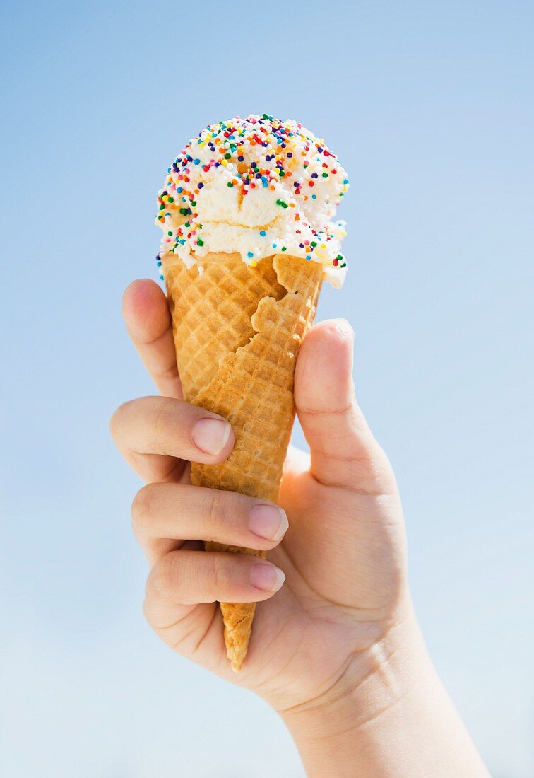 A Hand Holding An Ice Cream Cone With A License Images 11216375 Stockfood 6070
