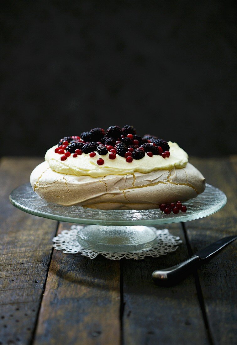 Pavlova with white chocolate cream and berries