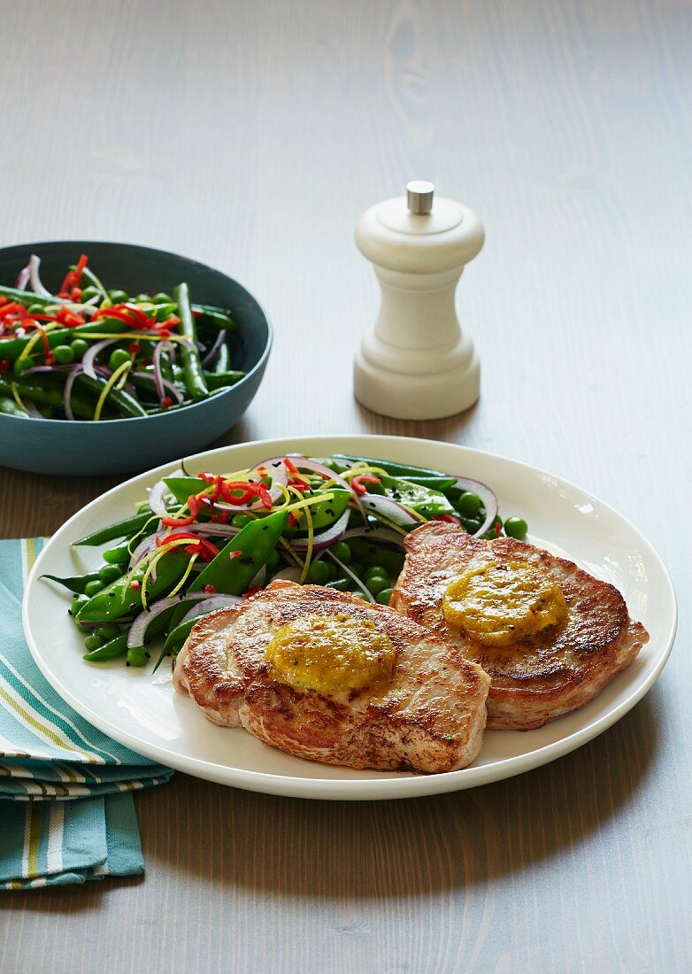Pork steaks with chilli butter and a sugar snap pea salad (Asia)