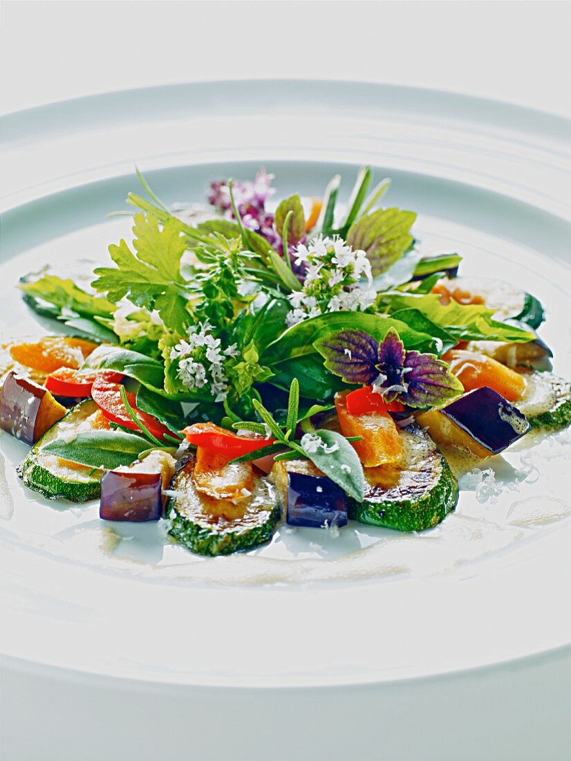 A herb salad with roasted vegetables