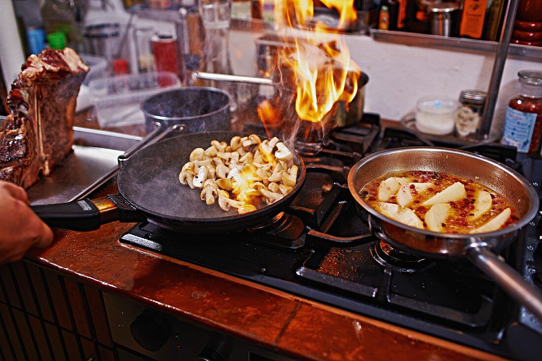 Mushrooms being fried in a pan