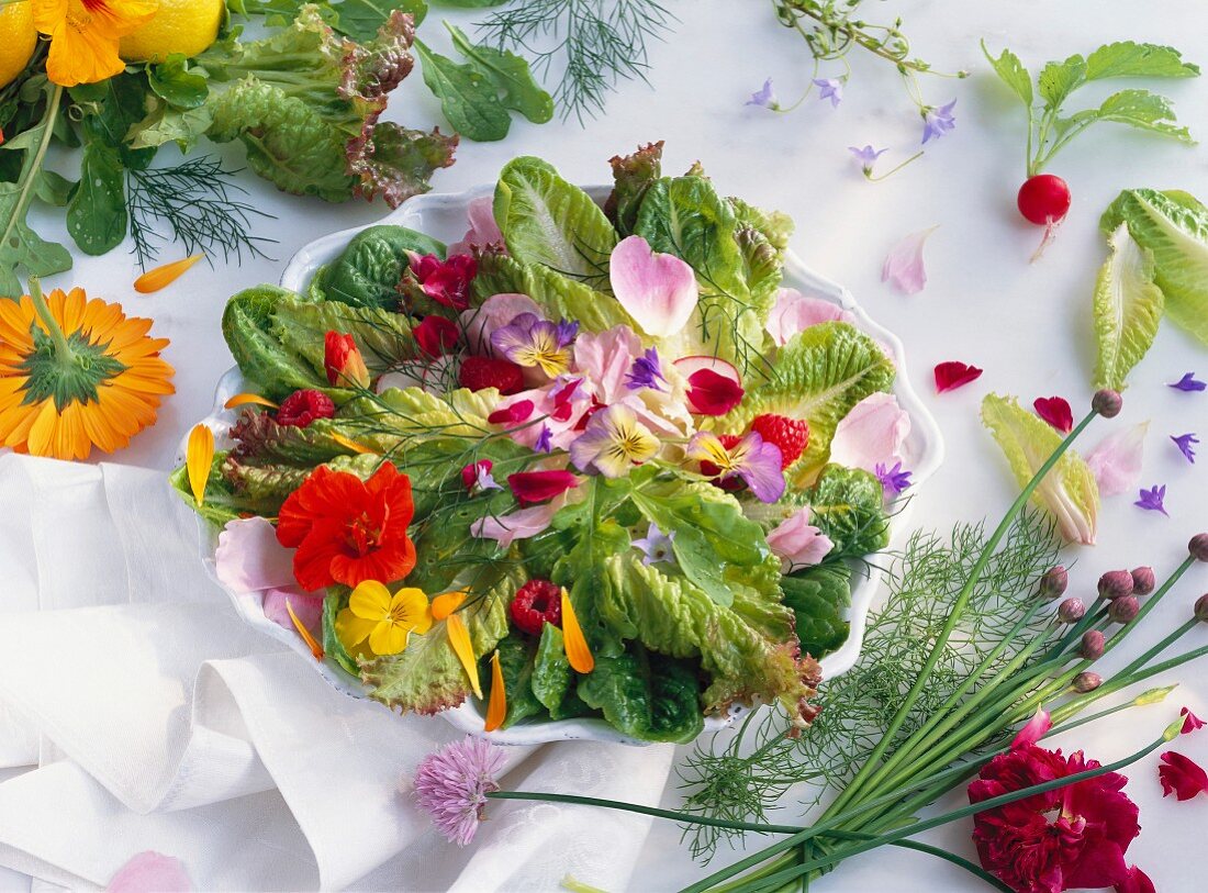 A colourful plate of salad with edible flowers