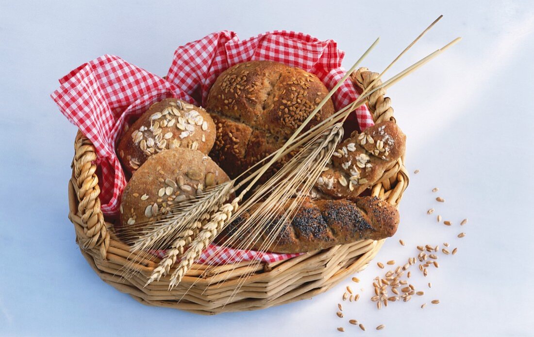 Assorted wholemeal rolls in a bread basket
