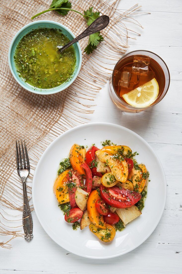Potato and Tomato Salad Tossed with Chimichurri and a Glass of Iced Tea