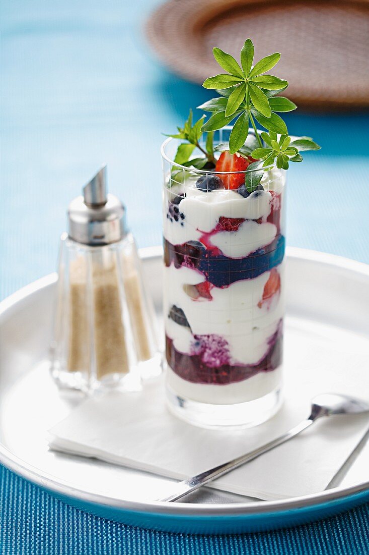 Quark and yoghurt dessert with berries and woodruff