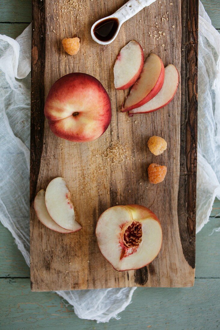 Preparing peaches on a wooden board