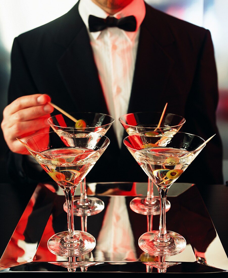 A gentleman holding martinis, Sweden.