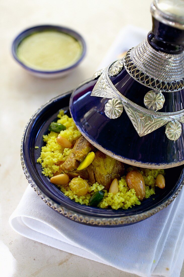 Lamb tagine with pistachios, pine nuts, turmeric and raisins (Tunisia)