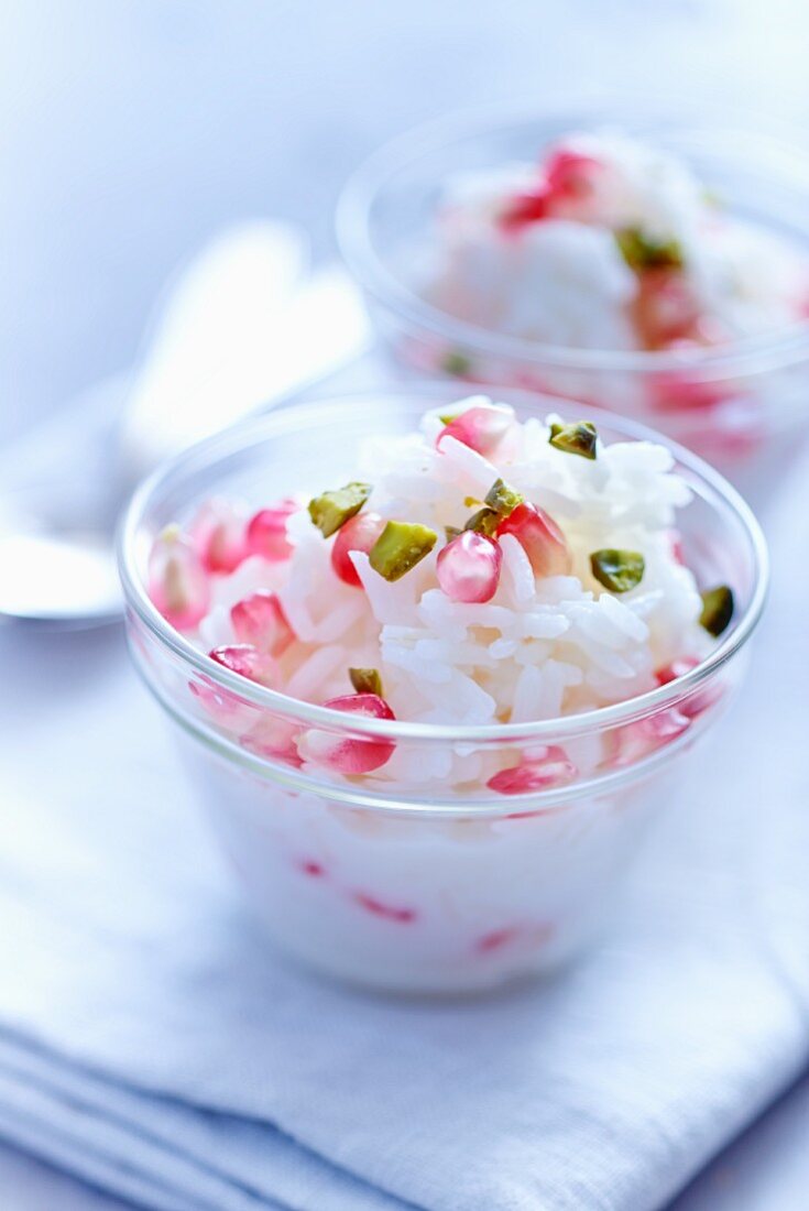 Rice pudding with pomegranate seeds and pistachios