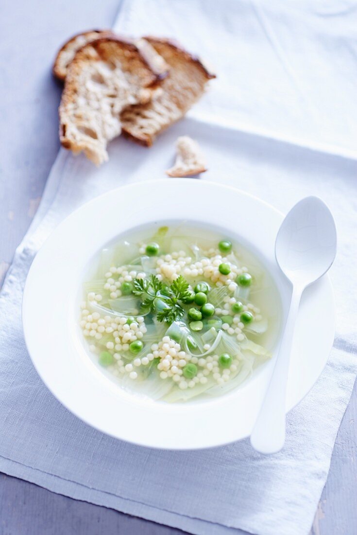 Clear broth with peas