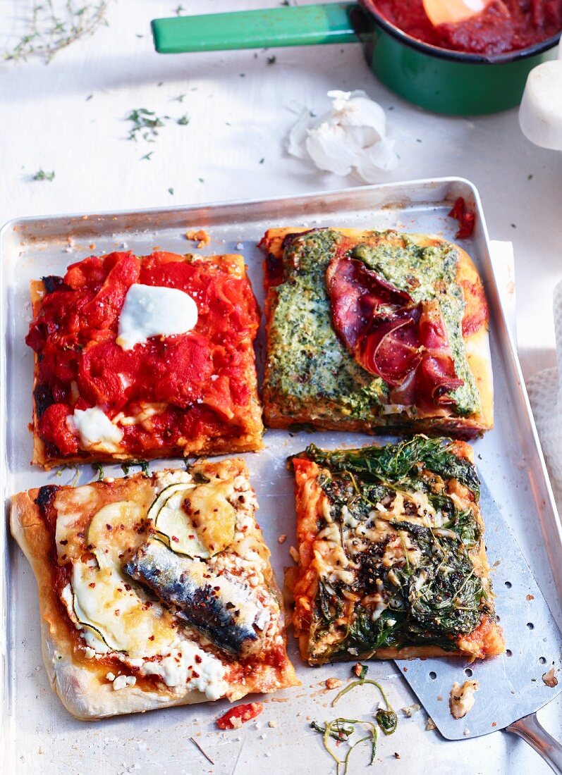 Tray-baked pizza with pesto rosso and four assorted toppings