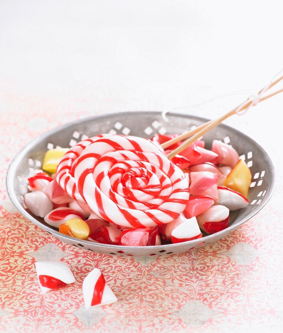 Plate with lollipops and peppermint hard candies