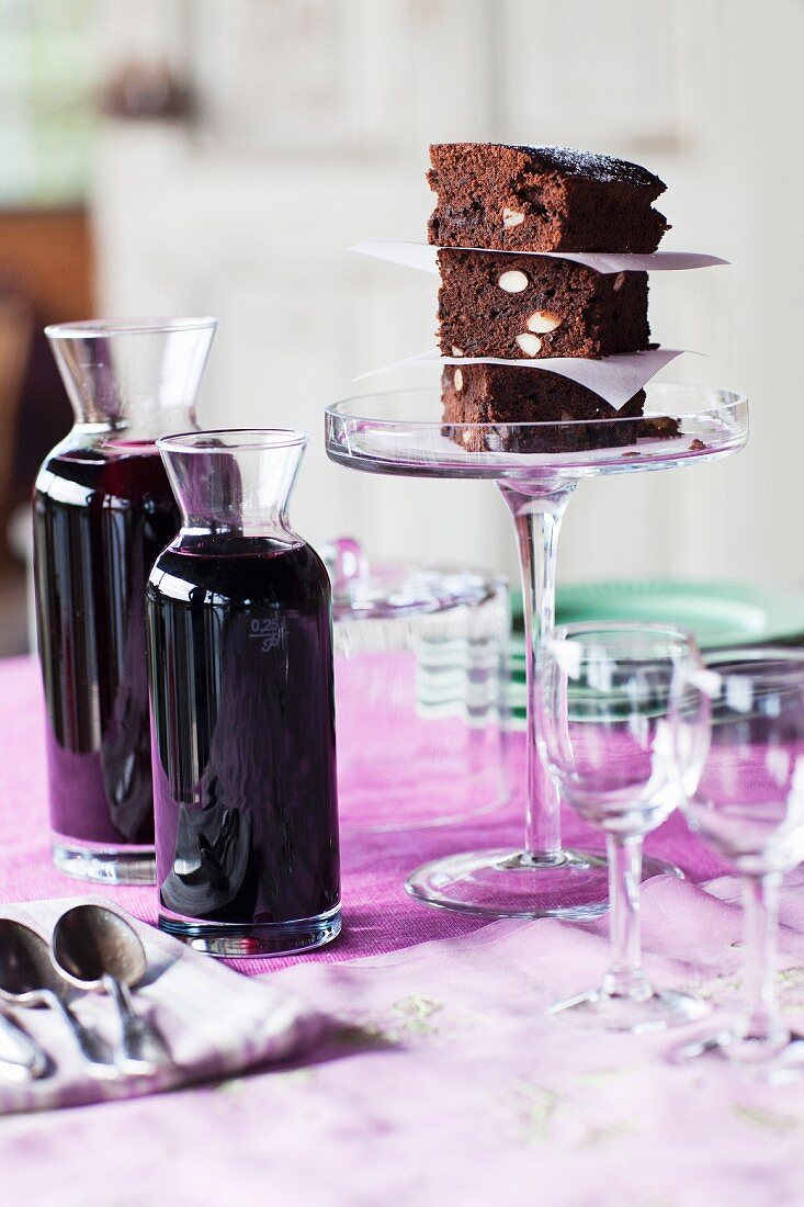 Close up of cake and wine carafes on table