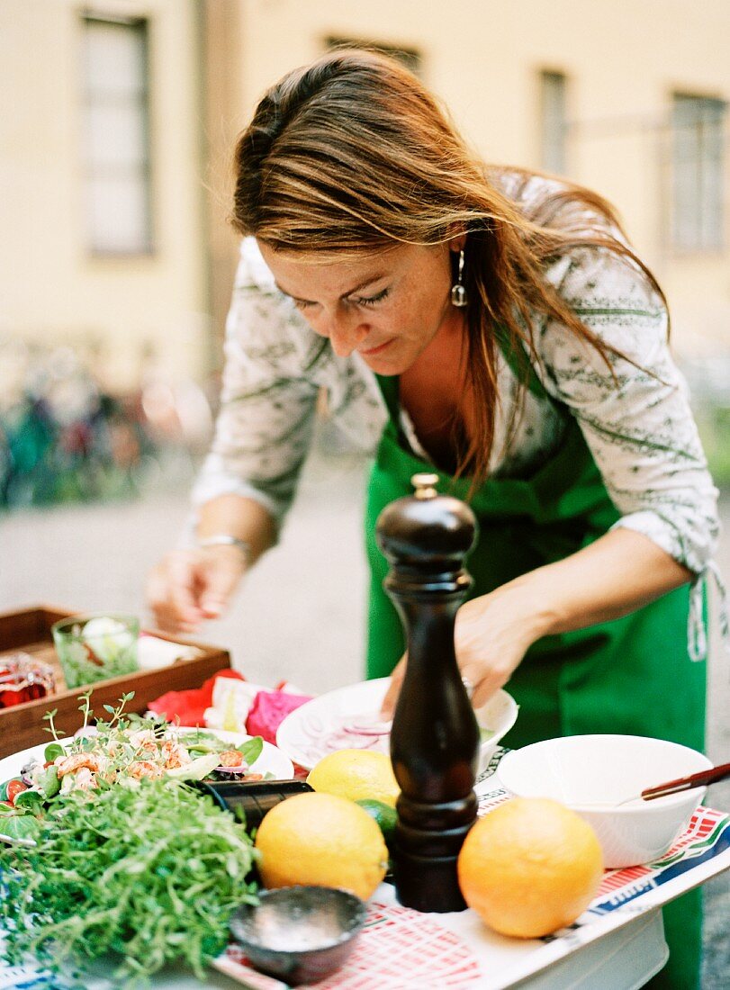 A woman preparing food.