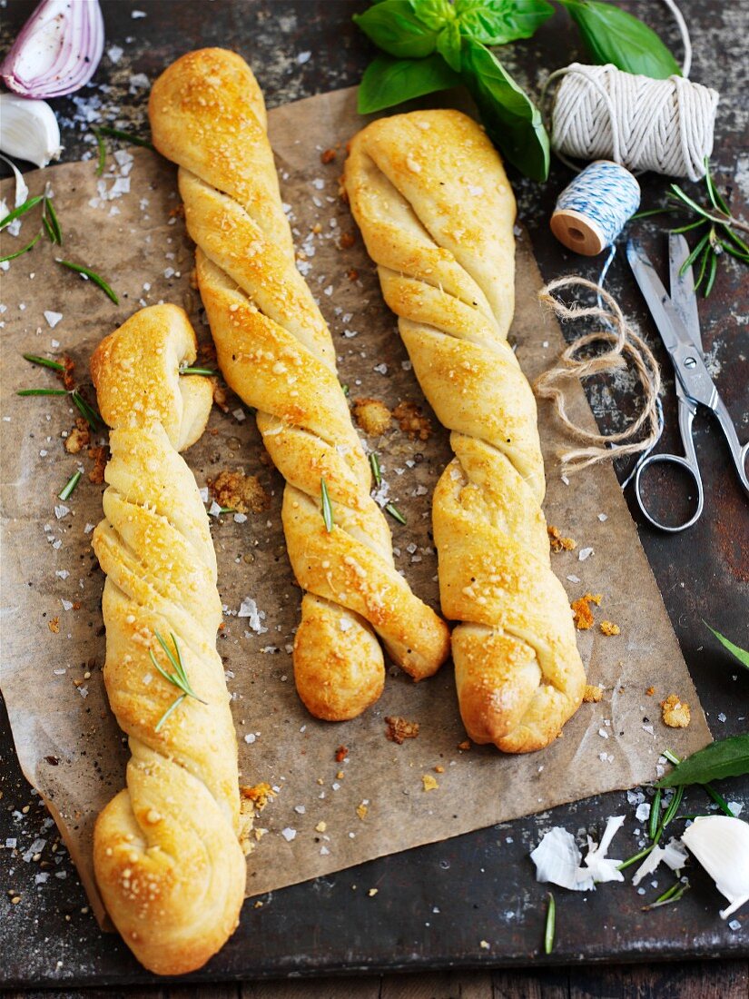 Twisted loaves of bread with garlic and rosemary