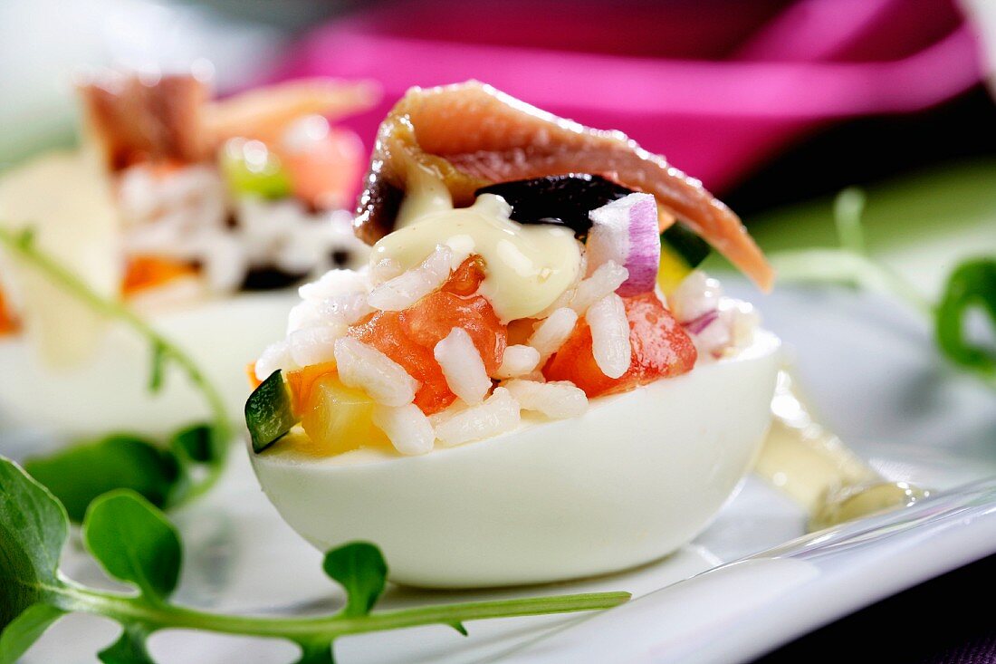 Devilled egg with rice salad and vegetables