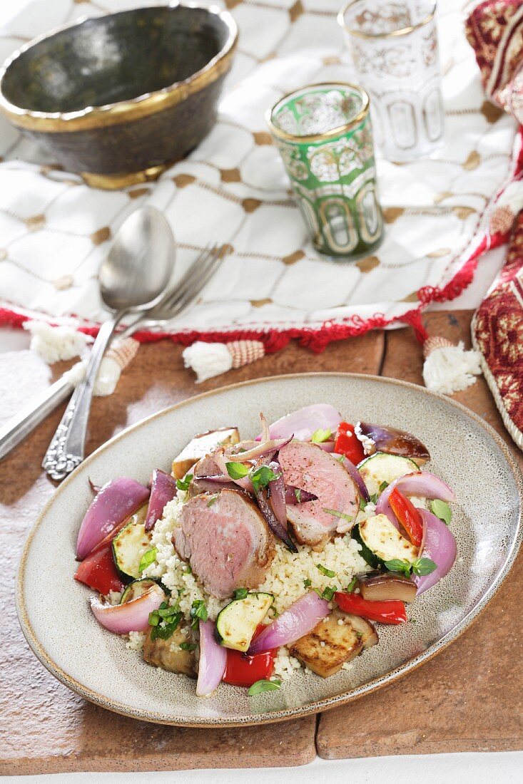 Couscous with vegetables and pork tenderloin