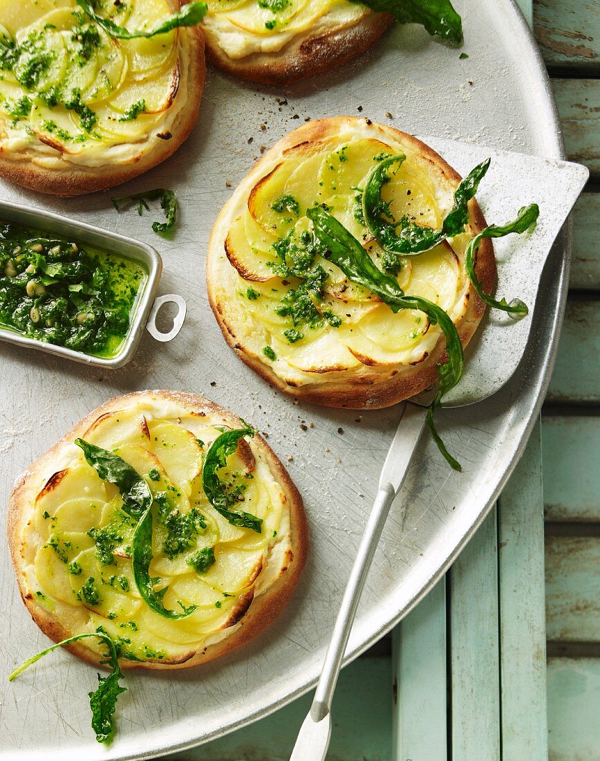 Mini potato pizzas with roasted dandelion pesto