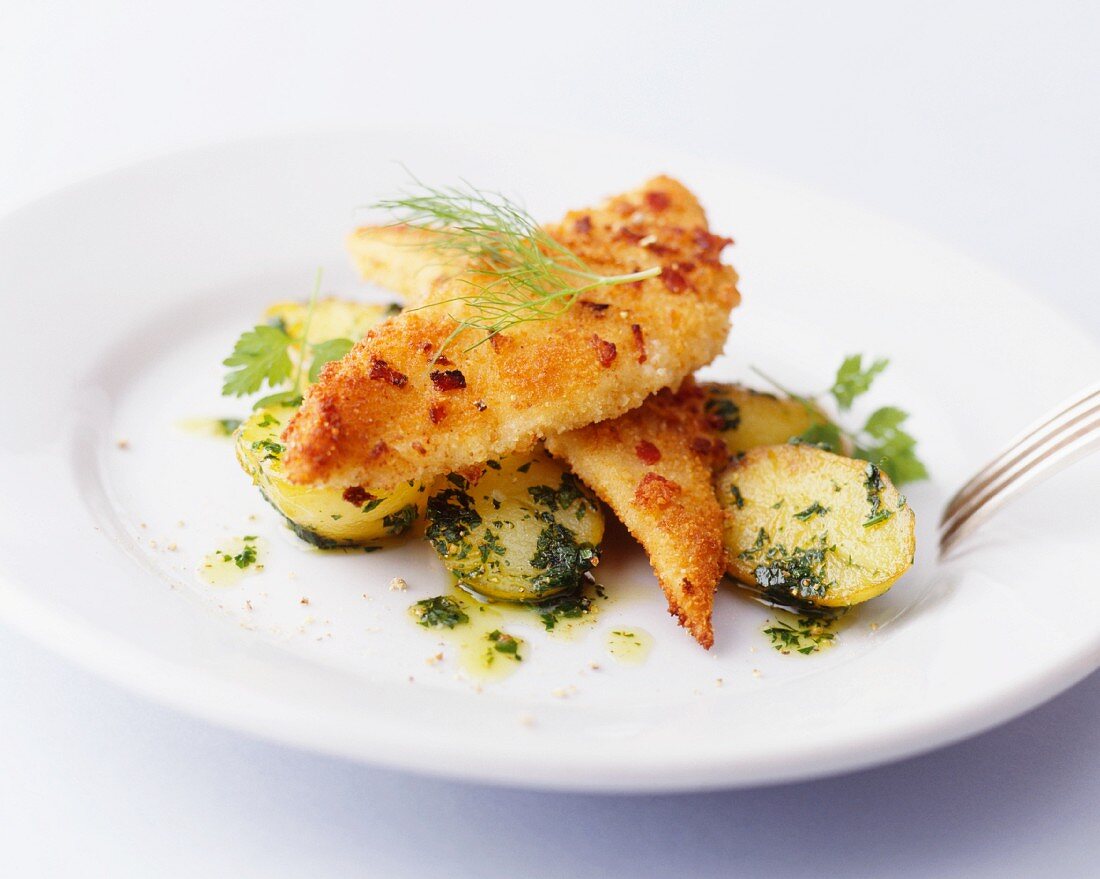 Breaded fish fillets with parsley potatoes
