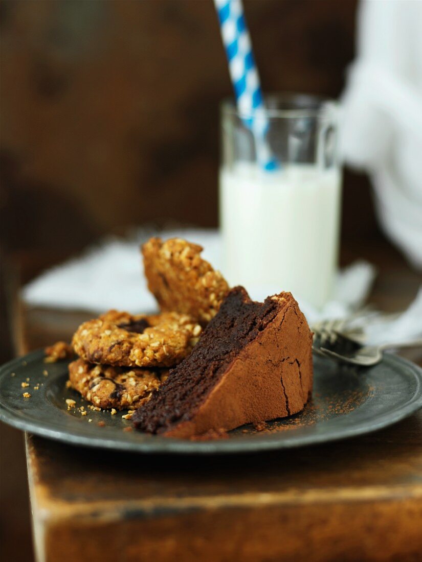 Chocolate cake, biscuits and milk