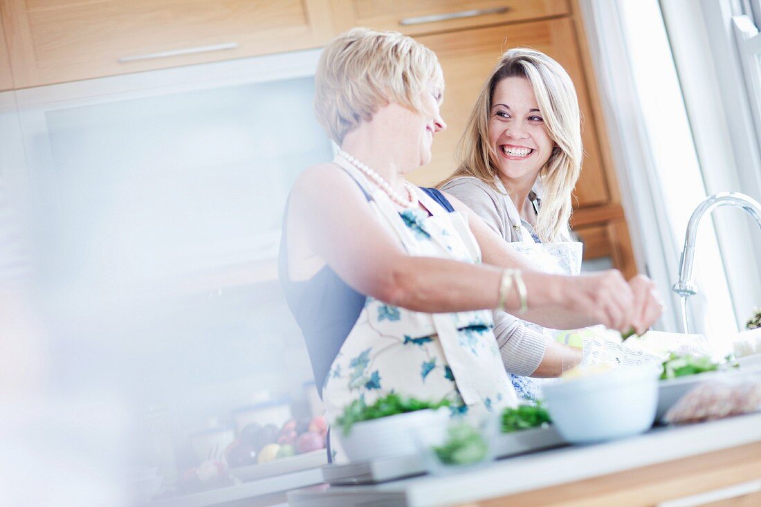 Two woman cooking together in the kitchen