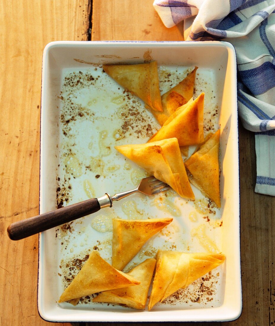 Filo pastry parcels in a baking dish