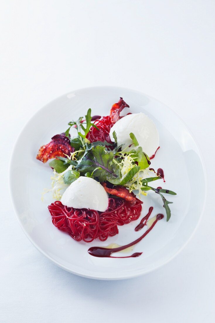 Quenelles of horseradish mousse on beetroot vermicelli