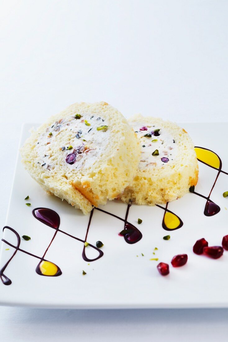 Sweet pomegranate roulade with ricotta, pistachios and dates