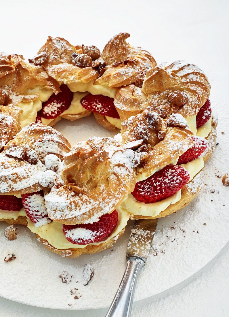 Choux pastry crown with strawberries and macadamia nuts