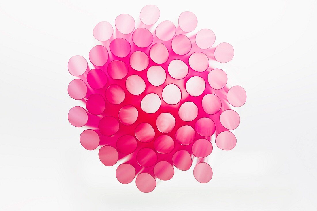 Studio shot of pink drinking straws