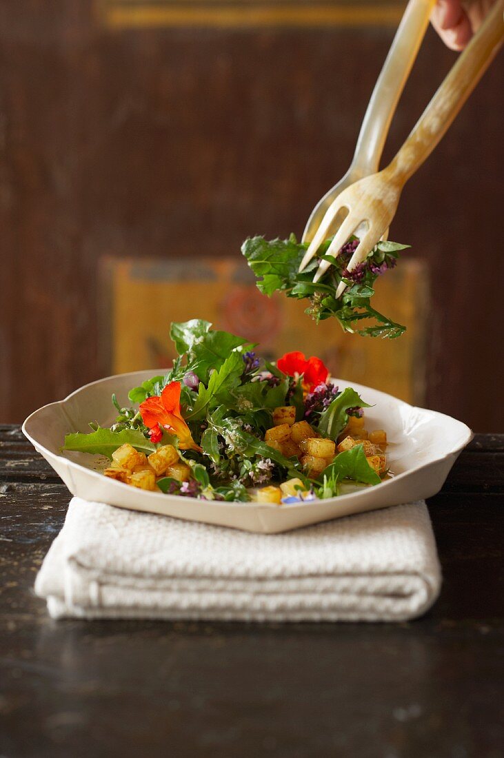 Herb salad with diced apples and potatoes