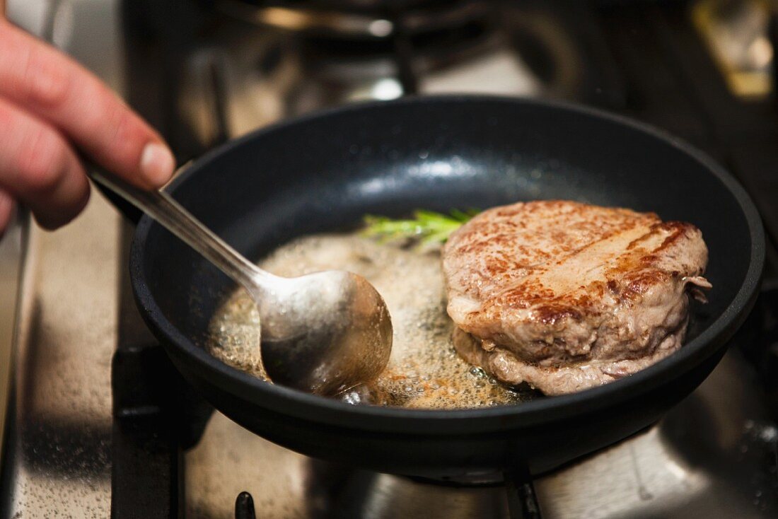 pan with butter and beef fillet