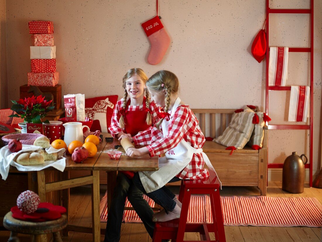 Two girls baking for Christmas